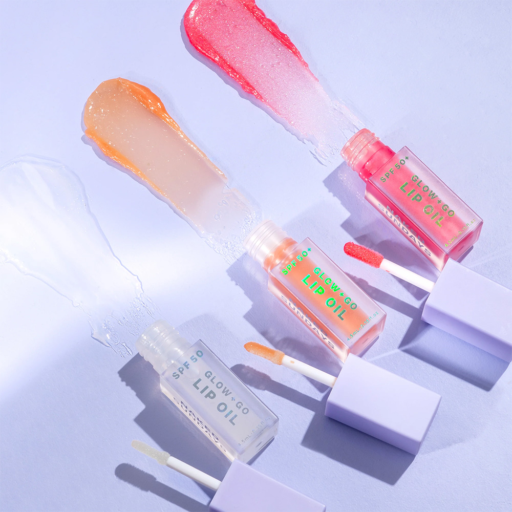 Naked Sundays Glow + Go Lip Oil SPF 50 in Watermelon, Salted Caramel, and Coconut.
